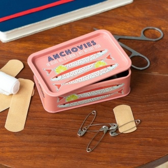 Pink mini storage tin with an illustrated anchovies fish on the front.