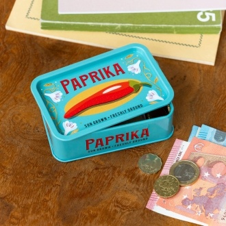 Mini storage tin with paprika illustration on the front.