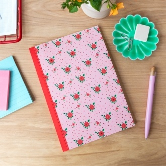 Pink notebook with a french rose design on the cover.