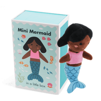 Mini mermaid soft toy placed beside a small illustrated box with mermaid design