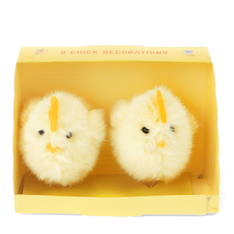 Two fluffy yellow chick decorations sitting side by side inside a small yellow cardboard box