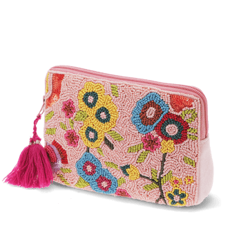 Pink beaded makeup bag with colourful floral designs and a bright pink tassel.