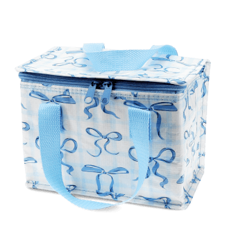 Insulated lunch bag with a light blue bow pattern and light blue handles.