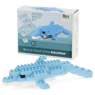 Completed dolphin brick model displayed beside its packaging box.