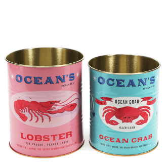 Two Ocean’s Brand storage tins featuring lobster and crab illustrations in pink and blue.