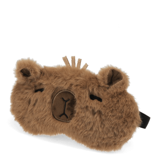 Light brown plush capybara‑shaped travel eye mask with stitched facial details