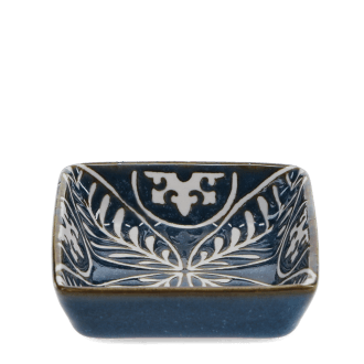 Blue ceramic square dish with white floral pattern interior