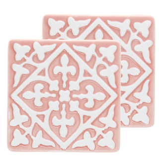 Set of two pink ceramic coaster with embossed pattern.