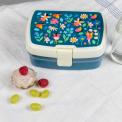 Dark blue plastic lunch box with cream and dark blue lid featuring print of fairies amongst flowers