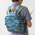 Mini backpack for kids with pictures of sharks worn by child