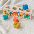 Wooden shape sorter toy featuring colourful illustrations of wild animals