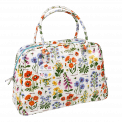 White oilcloth weekend bag with wild floral pattern