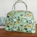Light green oilcloth weekend bag with illustrations of cats