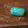 Turquoise mini travel case with print of cheetahs with jewellery to fit inside