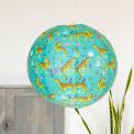 Turquoise paper lampshade with cheetah decoration installed in room