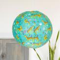 Turquoise paper lampshade with cheetah decoration installed in room