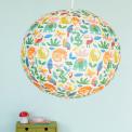 White paper lampshade with colourful wild animal decoration installed in room