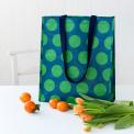 Recycled plastic shopping bag green circles dark blue background
