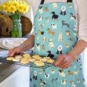 Best in Show Recycled Cotton Apron worn by adult holding baked goods