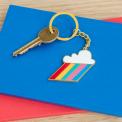 Cloud burst keyring on table with key attached