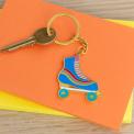 Roller skate keyring on table with key attached