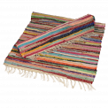 Multicoloured handloomed cotton rugs one rolled up and one partially rolled up