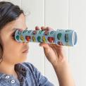 Child looking through kaleidoscope with print of vintage cars and other vehicles