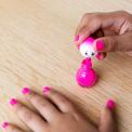 Child painting nails with Suki pink water based nail varnish