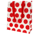 Recycled plastic shopping bag in cream with red spots