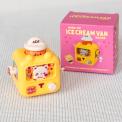 yellow wind up ice cream van with pink packaging box in background