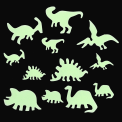 Various glowing dinosaur species on a black background