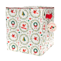 Cube-shaped storage bag with festive Christmas illustrations, featuring a red side handle and a tag