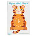 Tiger-shaped wooden wall clock in orange, featuring a white numbered dial with clock hands and a tail in packaging box