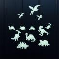 Various glowing dinosaur species on a black background