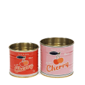 Two vintage-style cherry-themed storage tins, one small red and one larger pink