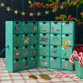 Green advent calendar with 24 festive dogs drawers