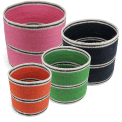 Four woven storage baskets in varying sizes and colours