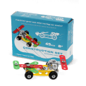 Completed colourful racing car model displayed with its packaging box