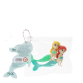 Mermaid-shaped erasers in a clear pouch with a tag showing safety warning in multilangual