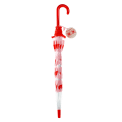Closed transparent umbrella with red handle, pink daisy pattern and a tag