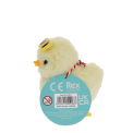 A fluffy yellow wind-up duck toy wearing yellow sunglasses with a tag 