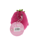 Dragon Fruit-shaped plush wind-up toy with a tag
