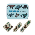 Dinosaur-printed plasters placed beside a matching storage tin featuring dinosaur illustrations
