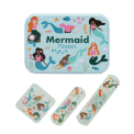 Mermaid-printed plasters placed beside a matching storage tin featuring mermaid illustrations