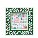 Square green picture frame with white leaf patterns on the border.
