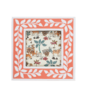 Square pink picture frame with white leaf patterns on the border.