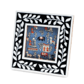 Square picture frame with white leaf patterns and navy blue colour on the border.