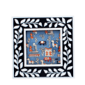 Square picture frame with white leaf patterns and navy blue colour on the border.