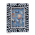 picture frame with a navy blue border and white leaf patterns