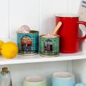 Cornish Sea Salt and Seaweed Pepper tins repurposed as kitchen storage on a shelf.